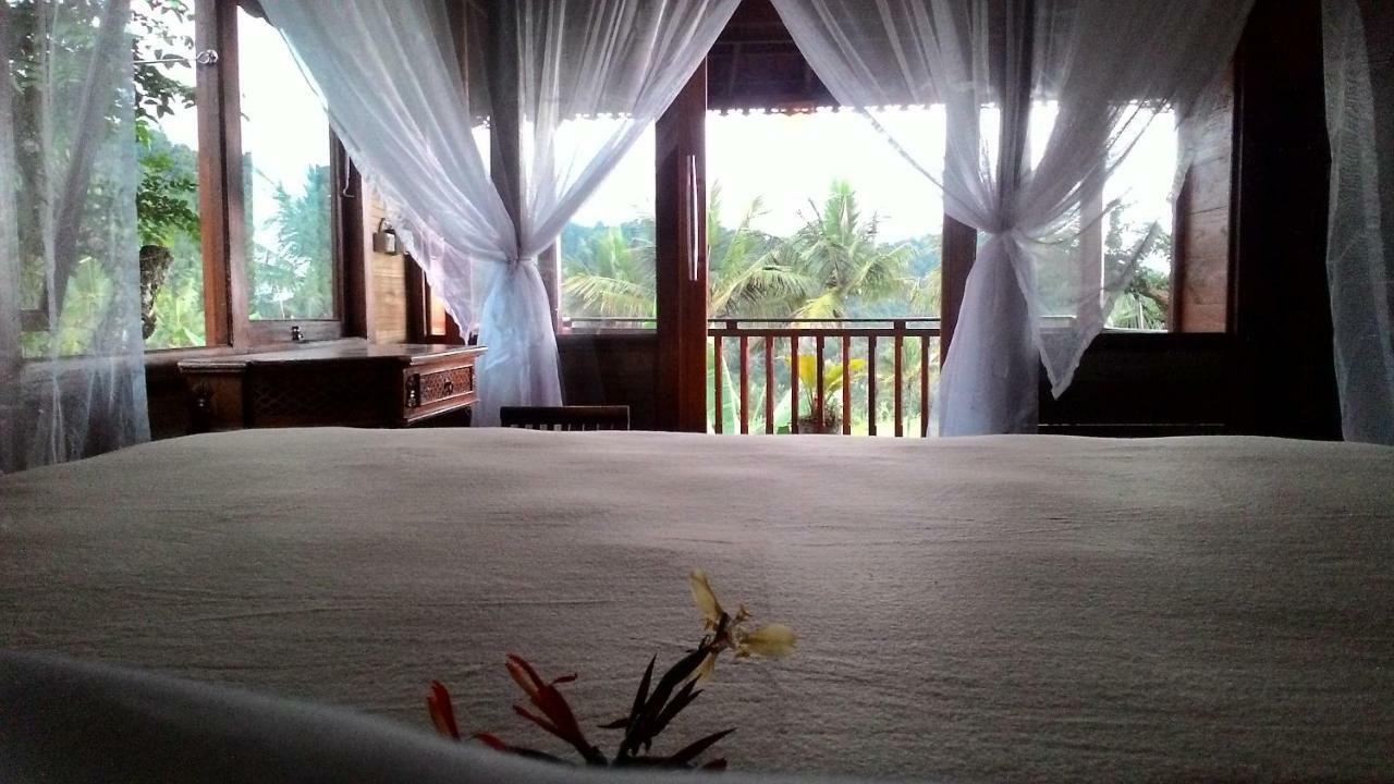 Kubu Shanti Sanda Munduk Esterno foto